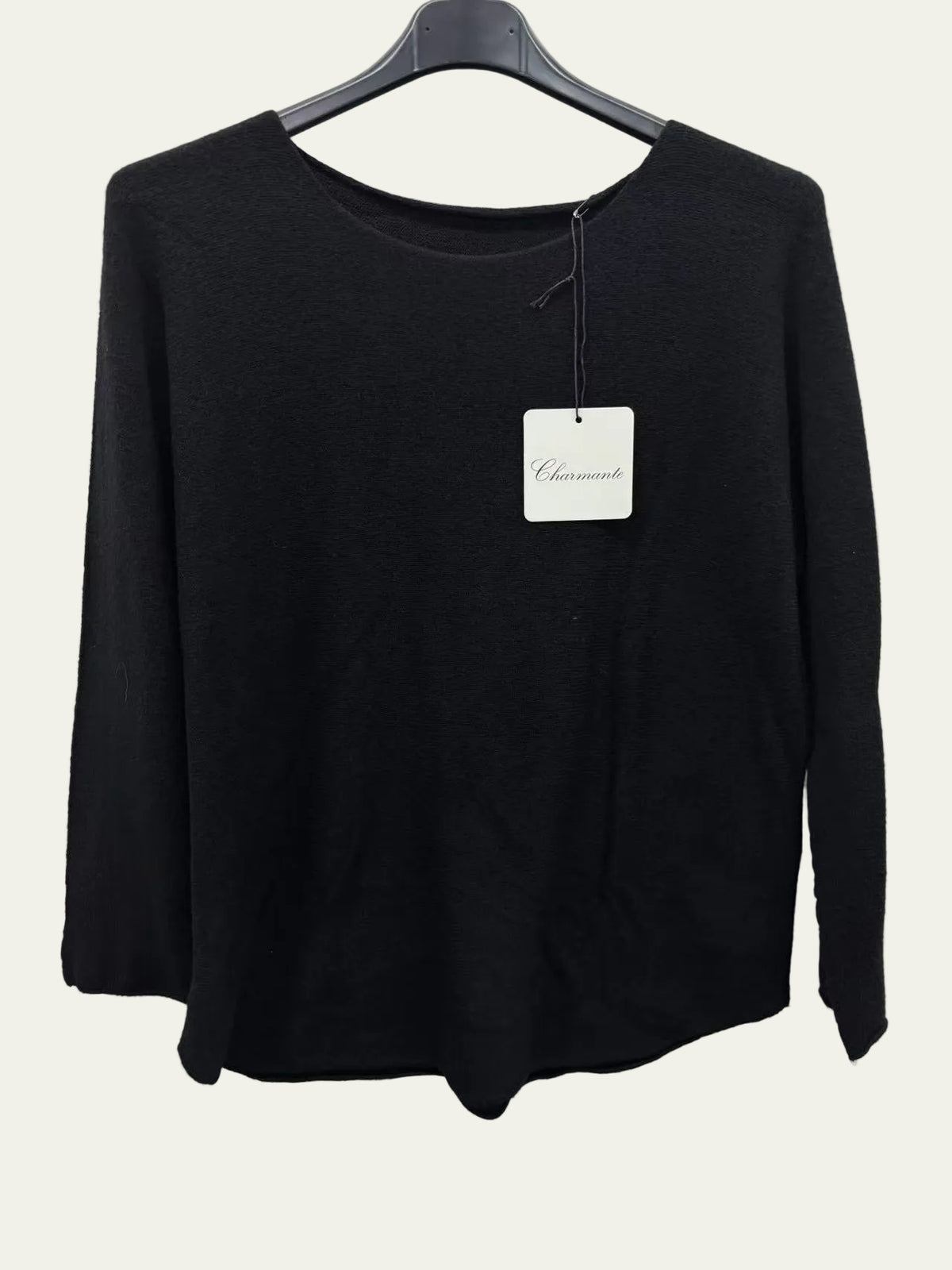 Black long-sleeve shirt on a hanger 