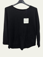 Black long-sleeve shirt on a hanger 