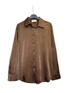 A brown long-sleeve button-up shirt with a satin fabric