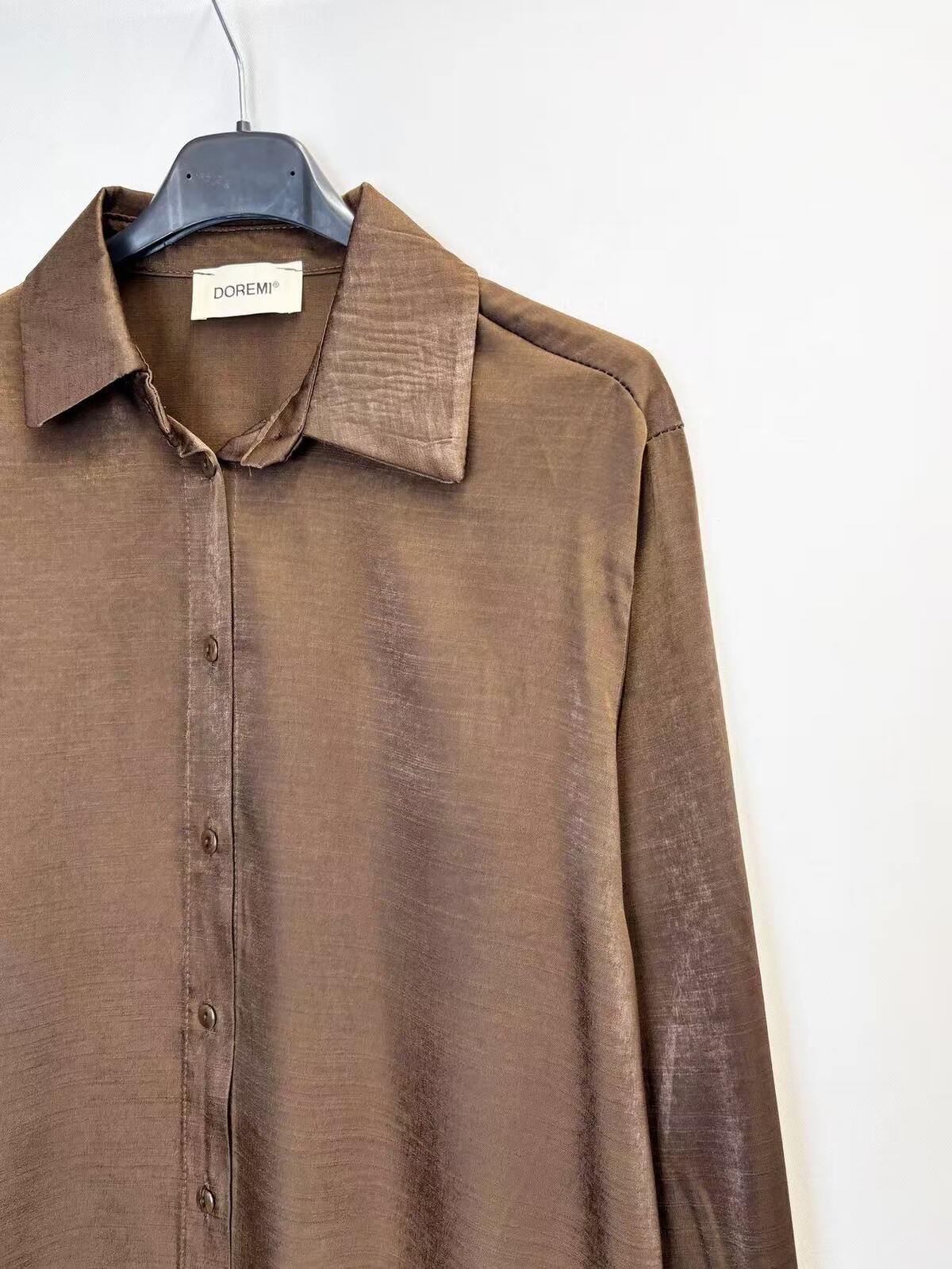 A brown long-sleeve button-up shirt 