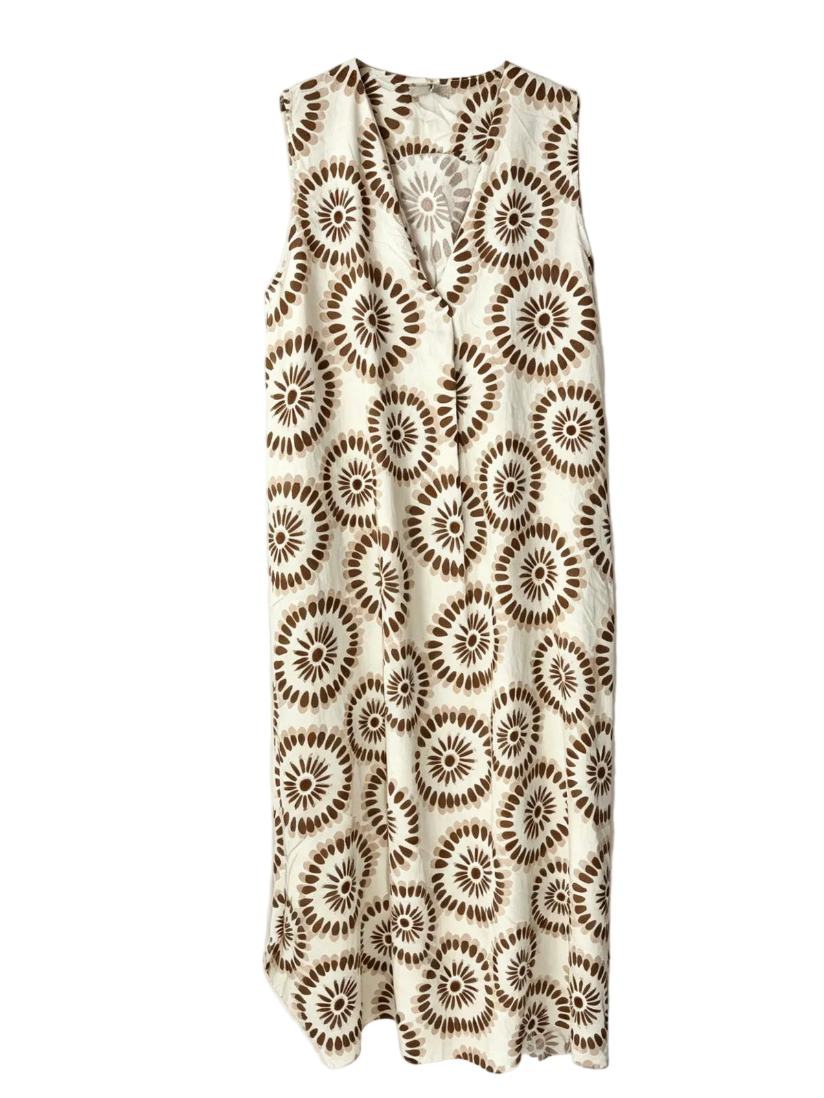 A sleeveless V-neck dress featuring an all-over brown and cream circular floral or sunburst pattern, laid flat against a light off-white background.
