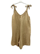 A light tan linen mix playsuit with tie straps,