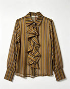 A long-sleeve striped blouse with a ruffled bow detail at the collar, shown flat against a light gray background.