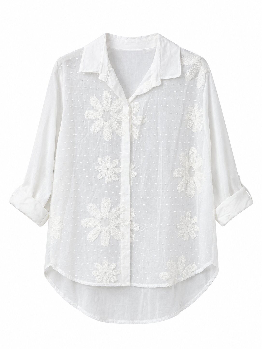 A white long-sleeve button-up blouse with a pointed collar, featuring a textured gingham pattern and large floral applique details, shown against a plain white background.