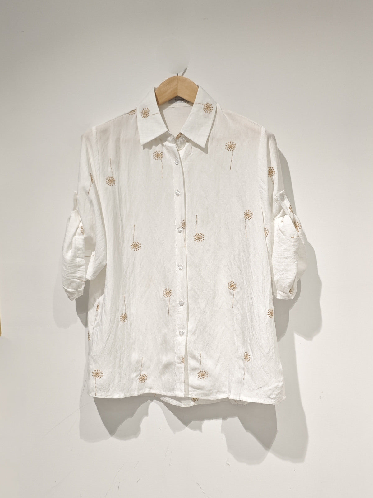 white embroidered shirt with roll up sleeves