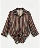 A long-sleeve button-up shirt with a vertical stripe pattern in featuring a pointed collar 