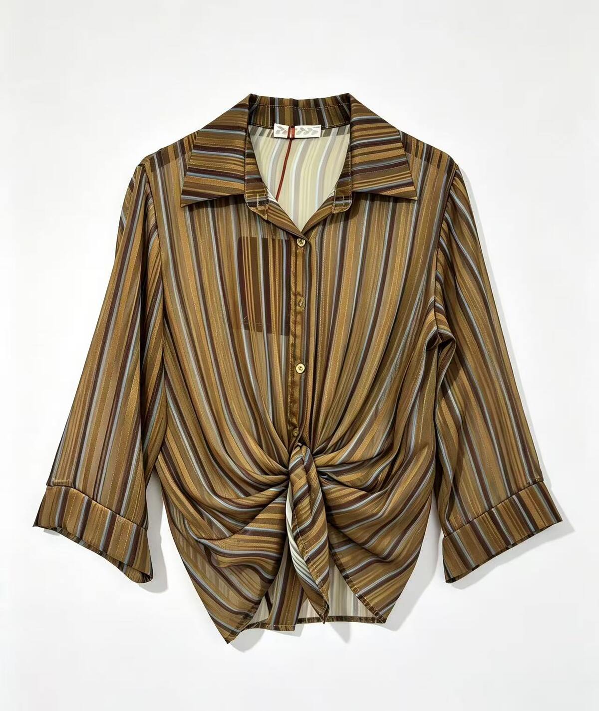 A three quarter sleeve button-up shirt with a knot detail at the hem.