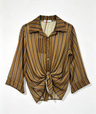 A three quarter sleeve button-up shirt with a knot detail at the hem.
