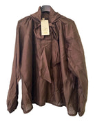 A brown long-sleeve blouse with a high gathered collar, front tie detail, and elasticized cuffs,