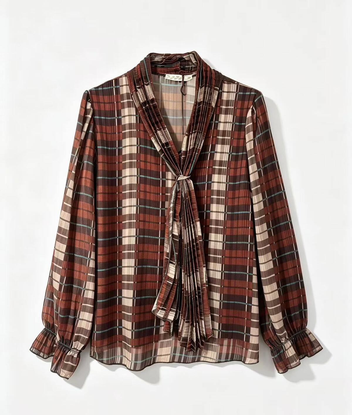A long-sleeve plaid blouse with a shawl collar, front tie, and ruffled cuffs, shown flat against a white background.