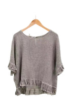 Chocolate ruffled blouse on a white background