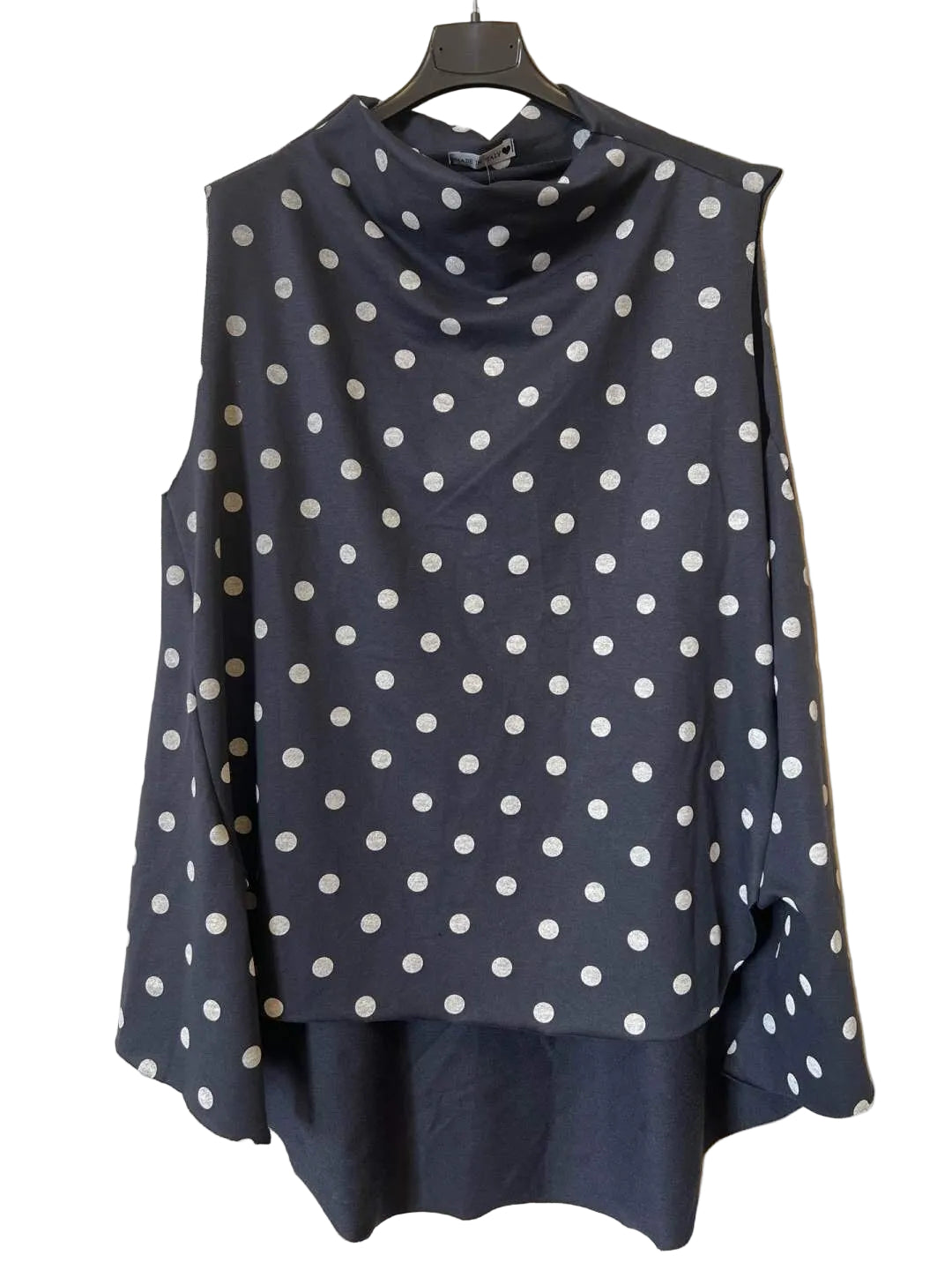 A navy blue long-sleeve top with white polka dots