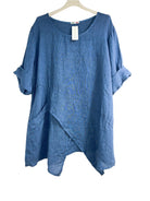 Blue asymmetrical linen tunic top with three-quarter sleeves.