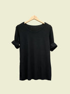 Black top with round neck and long sleeves
