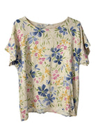 A short-sleeve top with a cream-colored base and a watercolor-style floral print featuring blue, pink, and yellow flowers with green leaves.