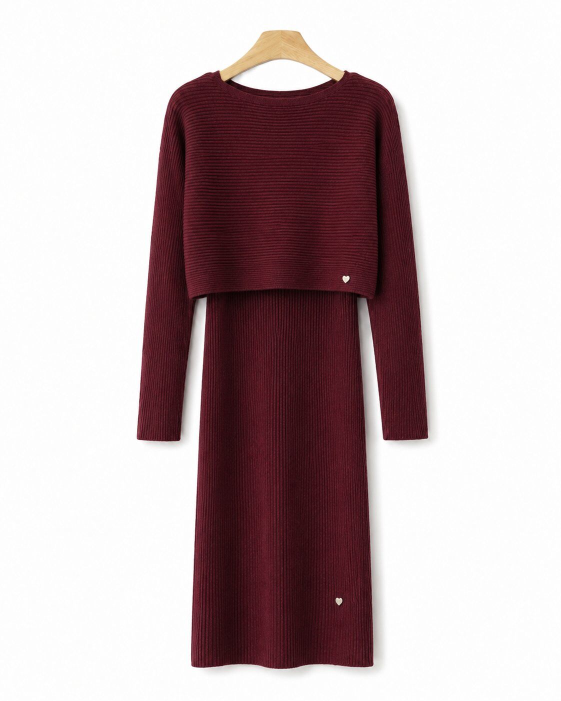 A ribbed knit sleeveless dress in burgundy with a matching sweater
