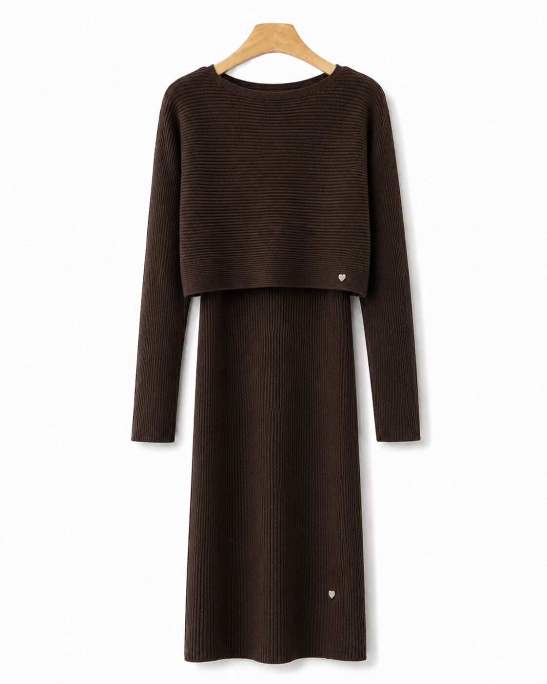 A dark brown ribbed knit long-sleeve dress with a cropped long-sleeve top overlay, hanging on a wooden hanger against a plain white background.