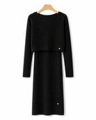 A black ribbed knit sleeveless dress with a cropped matching sweater
