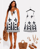Woman wearing a white dress with black patterns,