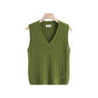 An olive green cable-knit sweater vest with a V-neck,