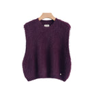 A sleeveless fuzzy knit sweater vest in deep purple, hanging on a wooden hanger against a plain white background.
