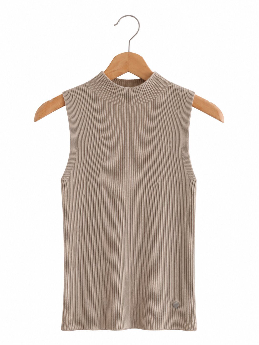 A sleeveless ribbed knit mock neck top in a light taupe-beige colour