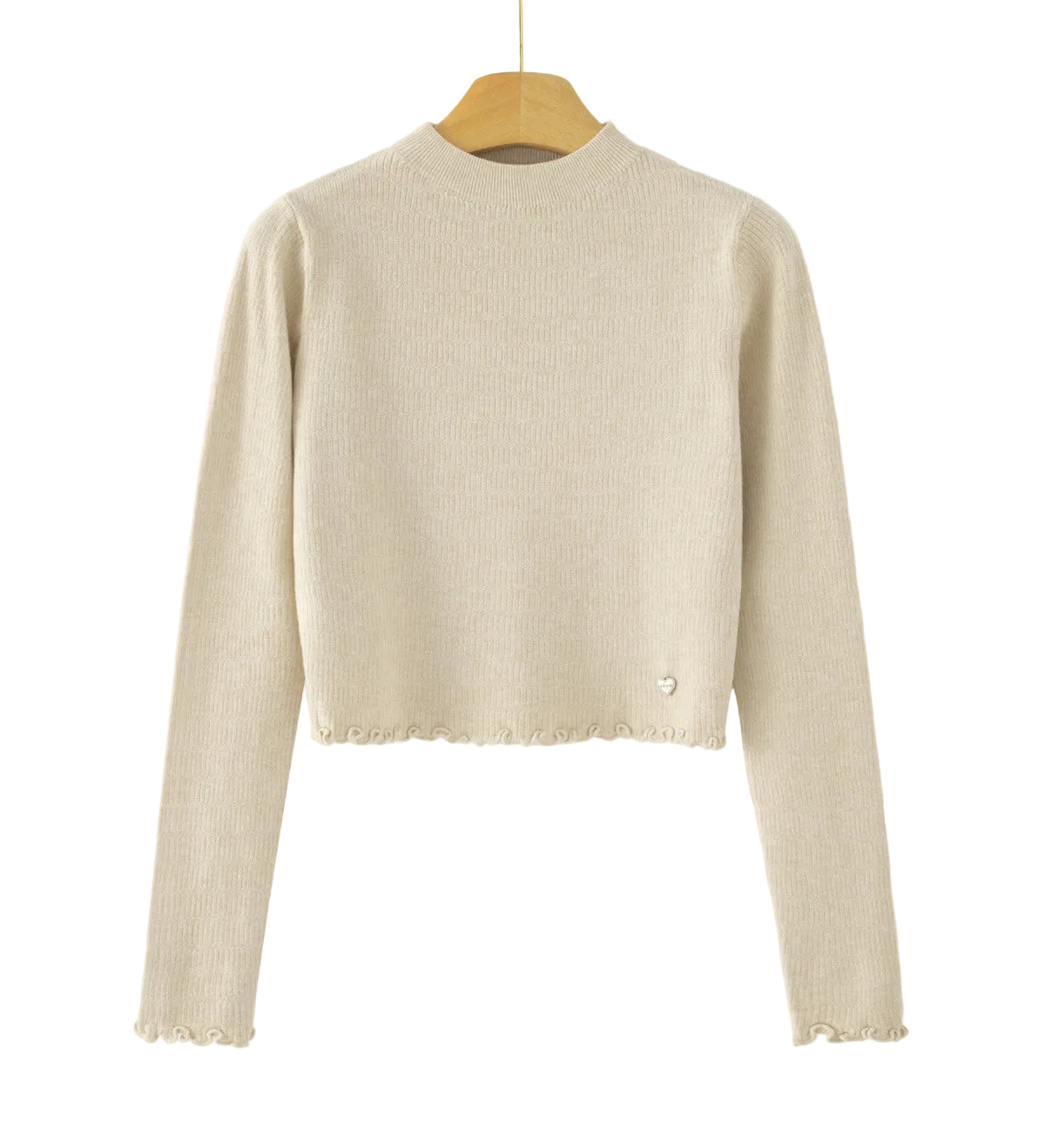A beige ribbed knit long-sleeve crop top sweater hanging on a wooden hanger against a white background