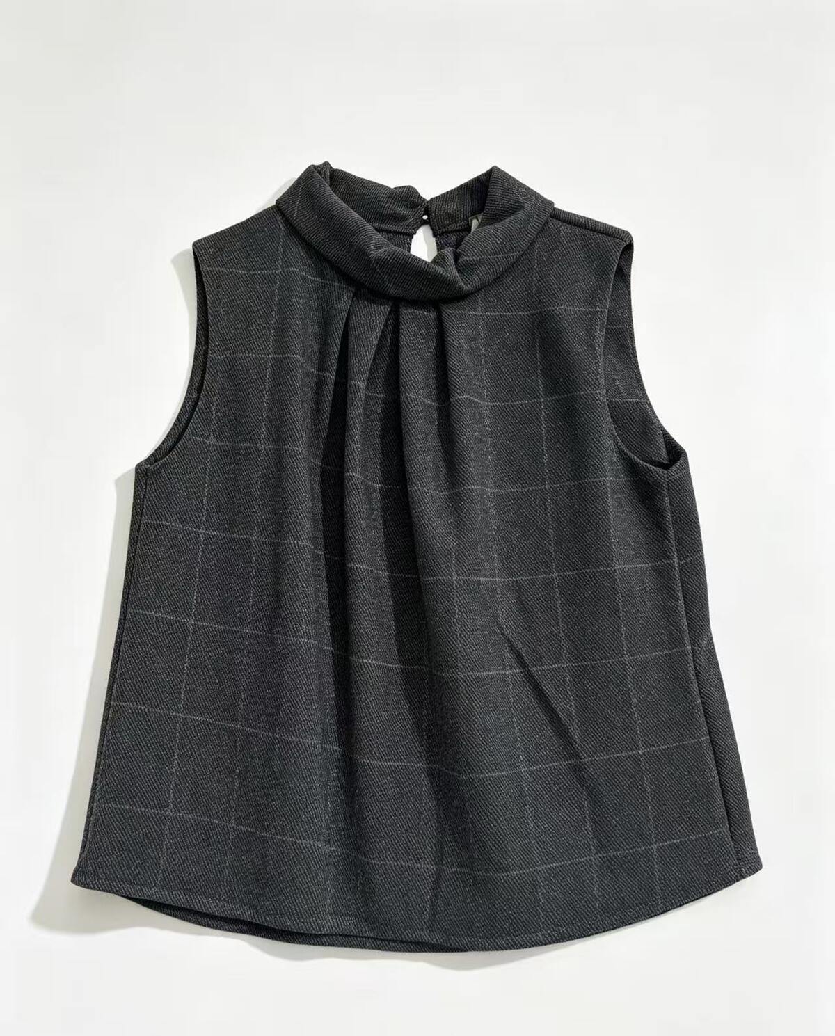 A sleeveless dark grey check top with a high gathered mock neck, displayed flat against a white background.