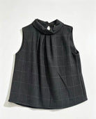 A sleeveless dark grey check top with a high gathered mock neck, displayed flat against a white background.