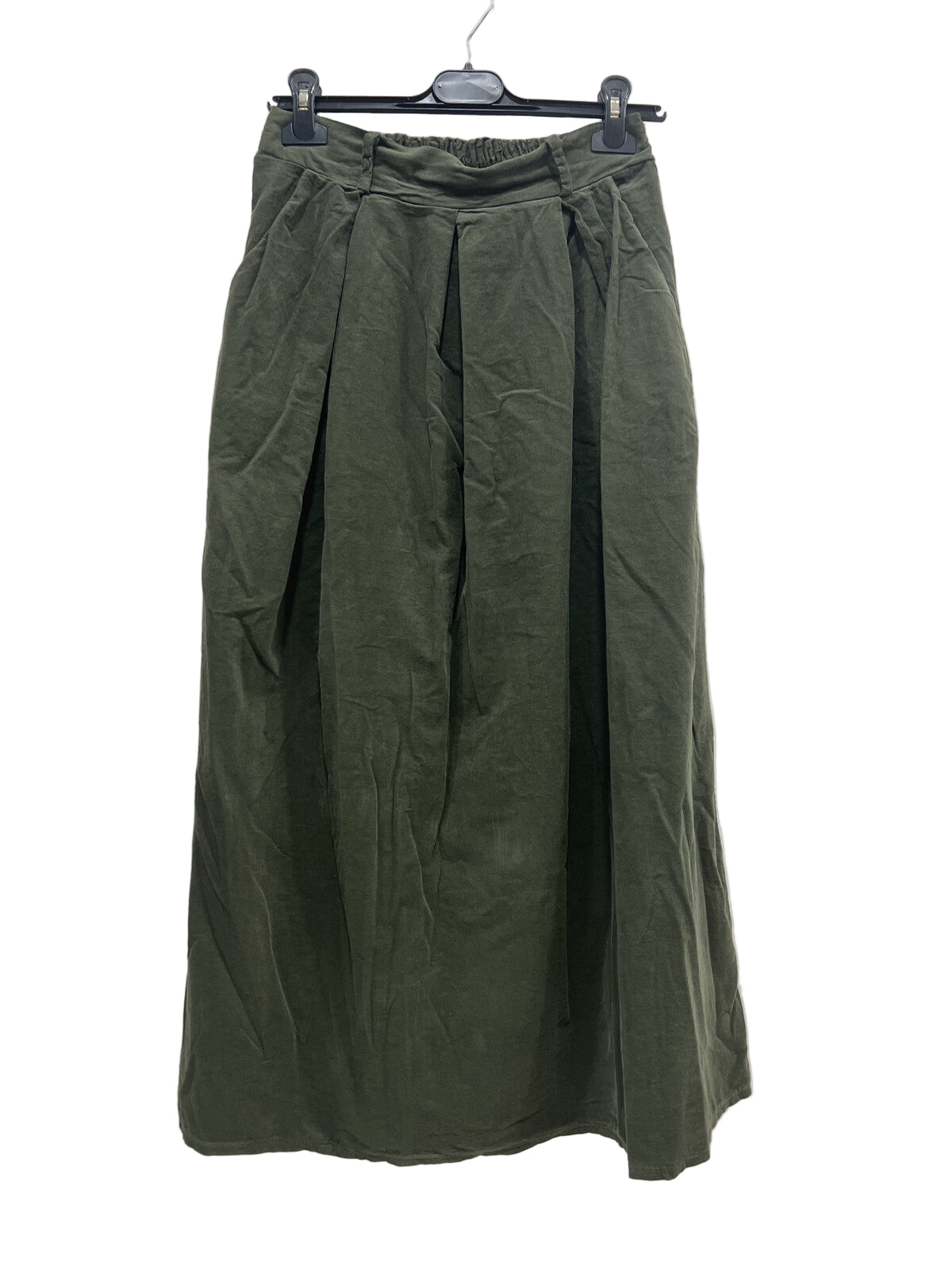 Green skirt on a hanger against a white background
