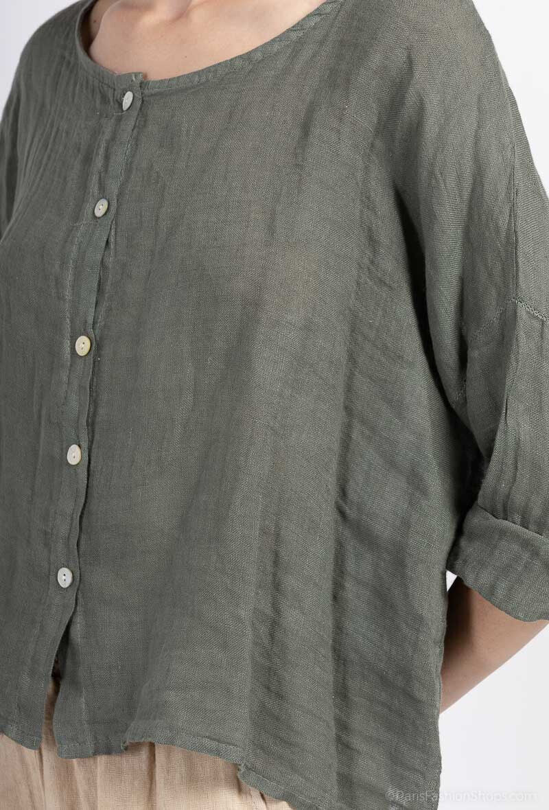 Khaki-button-up shirt worn by a person on a white background