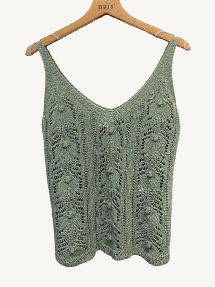 Green knitted vest on a hanger 