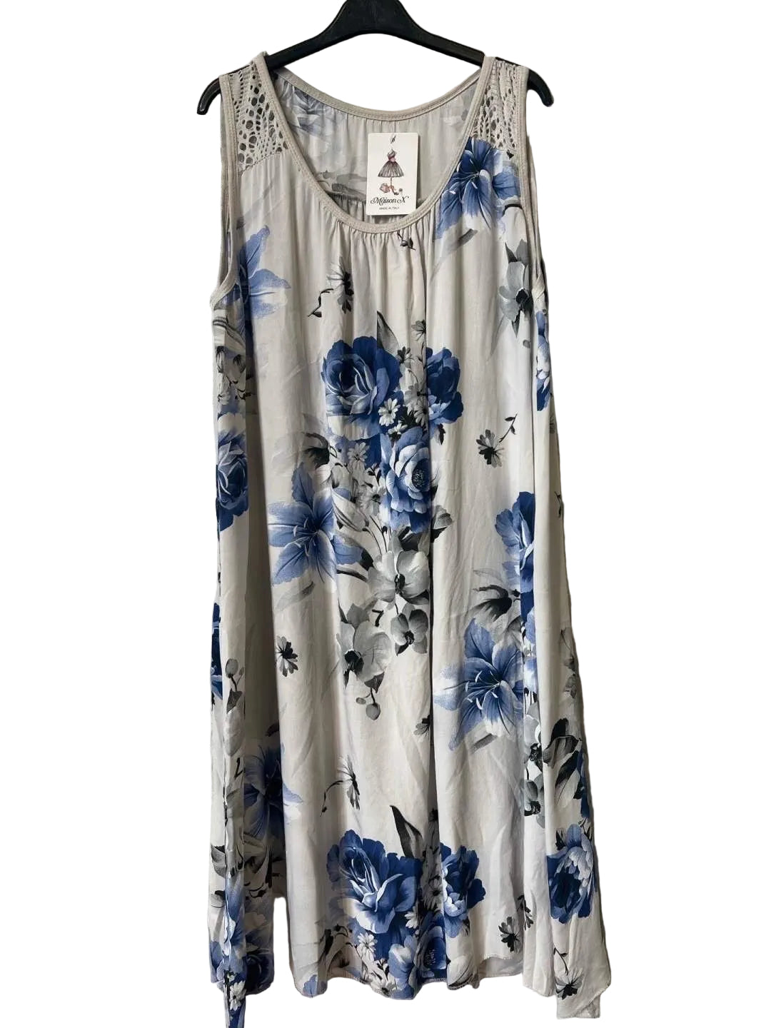 A sleeveless beige tank dress with a blue and gray floral print
