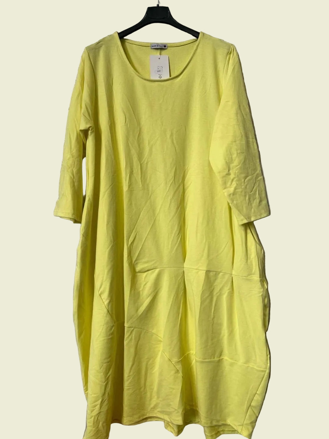 Yellow dress on a hanger 