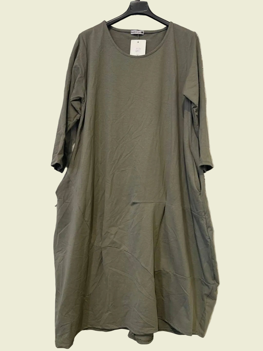 Green dress on a hanger 