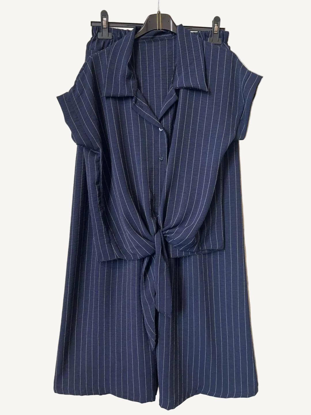 Navy stripe outfit on a hanger