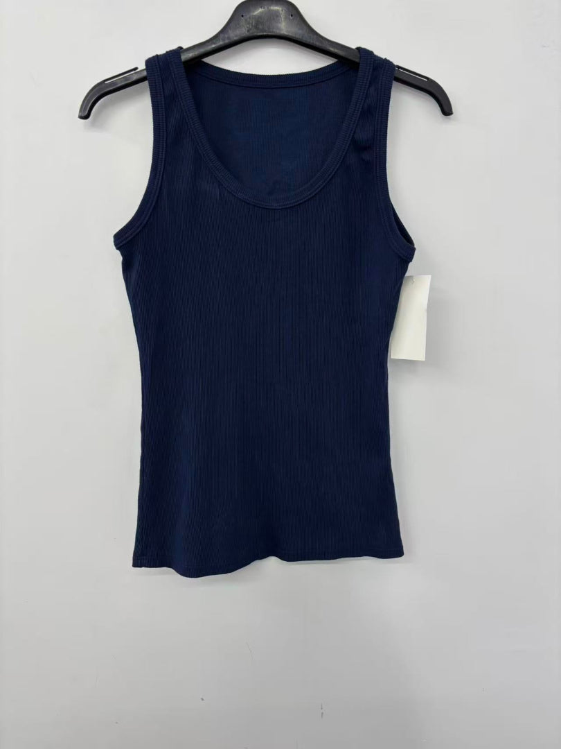 Navy blue tank top on a hanger with a white background
