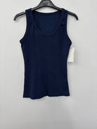 Navy blue tank top on a hanger with a white background