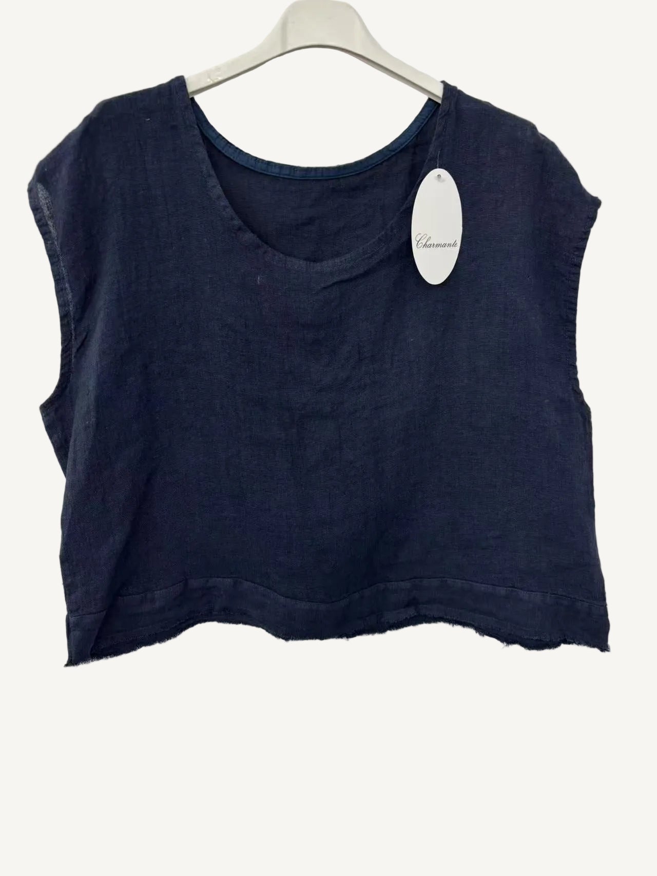 Navy blue sleeveless top on a hanger with a visible brand tag against a white background