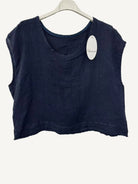 Navy blue sleeveless top on a hanger with a visible brand tag against a white background
