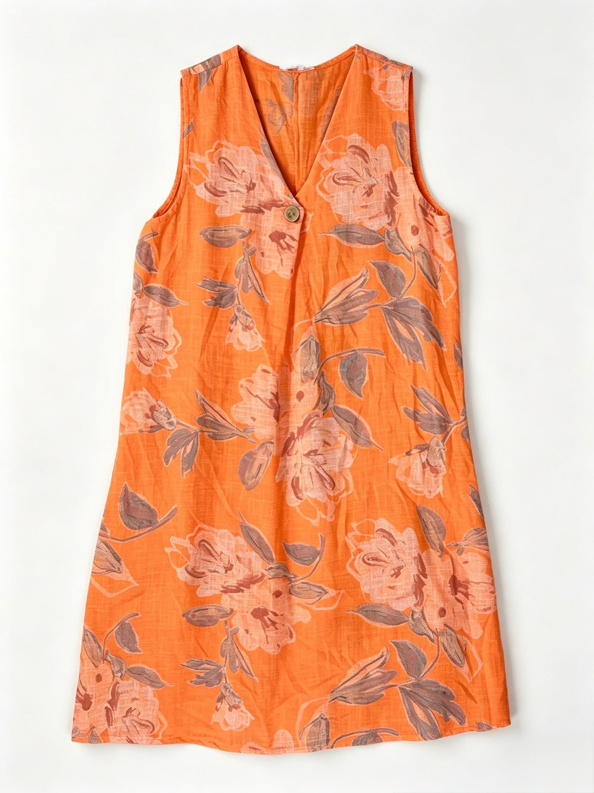 An orange sleeveless V-neck dress with a floral print 