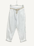 White pants with a belt 