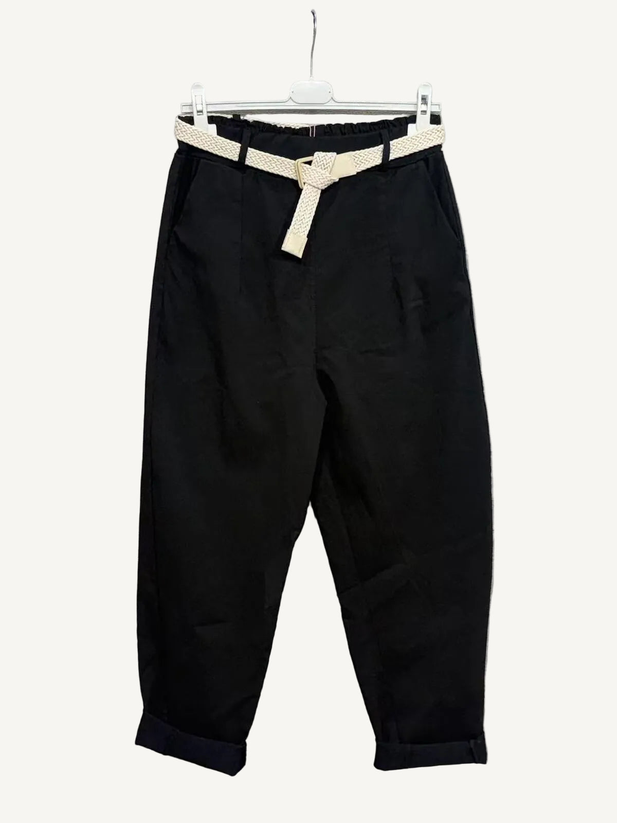 Black pants with a beige belt 