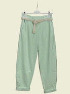 Light green pants with a belt