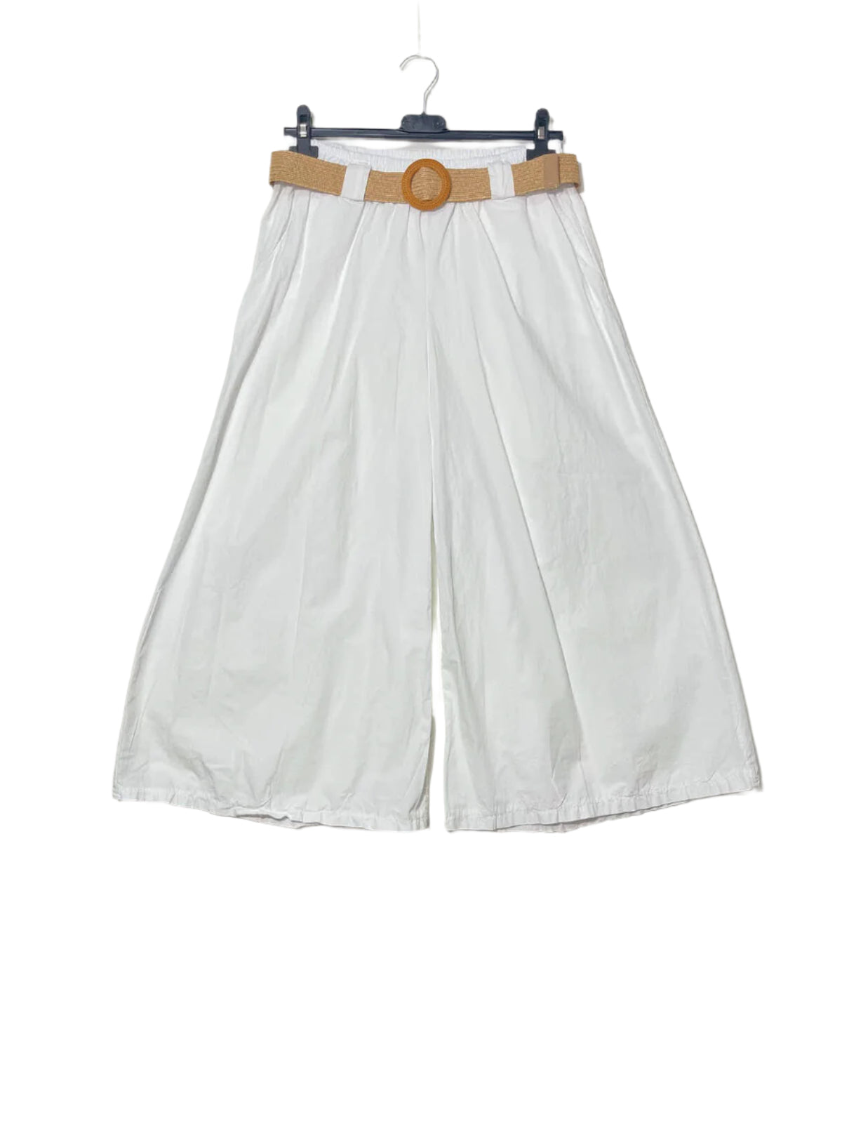 White wide-leg pants with a brown belt on a hanger against a plain background