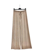 A pair of wide-leg trousers in beige