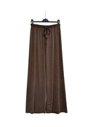 A pair of brown wide-leg pants with a drawstring waist