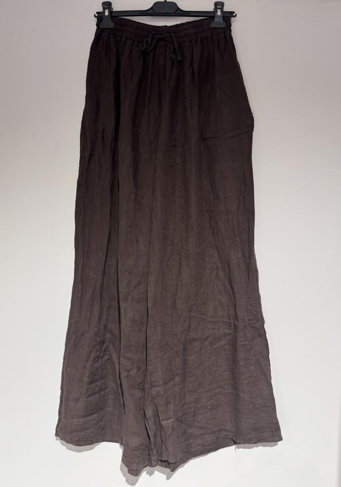 Brown skirt on a hanger against a white background