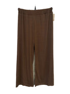 A pair of brown wide-leg trousers wit elasticated waist.