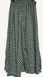 Green pants with white polka dots on a white background